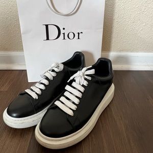 Black and white Alexander McQueens size EU 45 Men’s